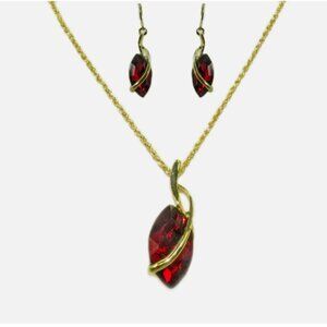 Large red crystal marquise pendant necklace earrings set with a gold wrap design